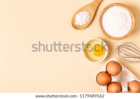 Similar – Image, Stock Photo Brown eggs and baking ingredients on a kitchen table. Rustic style.