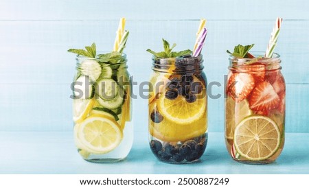 Similar – Image, Stock Photo Tasty infused water in bottle with drinking straw and ingredients: lime, strawberry and mint leaves at white background