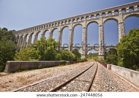 The picturesque nature of southern France with its famous landmark roman bridge , located near Avignon, France