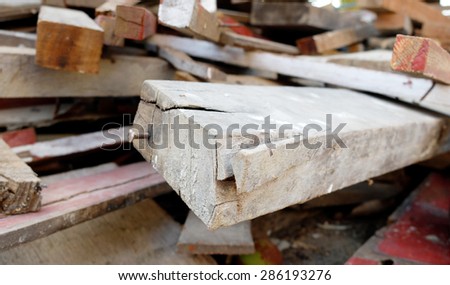 Pile of Wood with Nail Soft Focus from Construction Industry