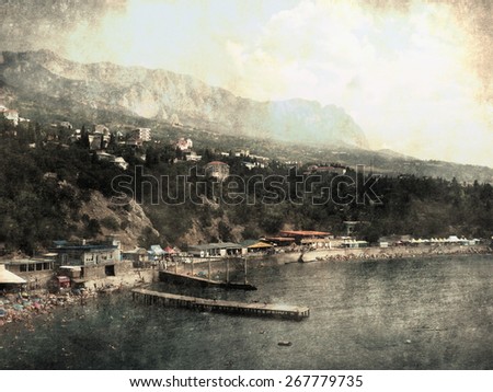 Landscape with beach, mountain and sea near Yalta in the Crimea. Vintage background. Old postcard, design in grunge and retro style.