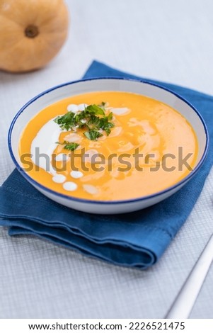 Similar – Image, Stock Photo Pumpkin creamy soup served on green leaf