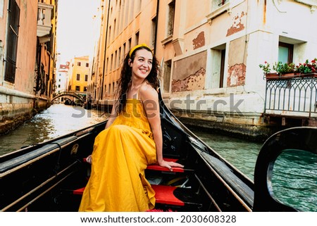 Similar – Image, Stock Photo Gondolas sailing along canal between city buildings