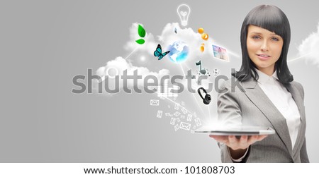 Poster portrait of young beautiful woman holding her universal device - tablet pc. Lots of things are appearing from the display. Universality of modern devices concept