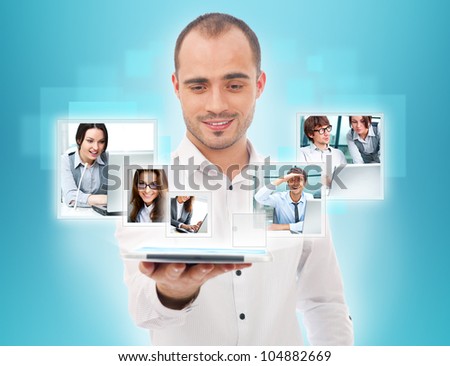 Adult businessman using his tablet computer to communicate his team. Virtual meeting technology for global business concept.