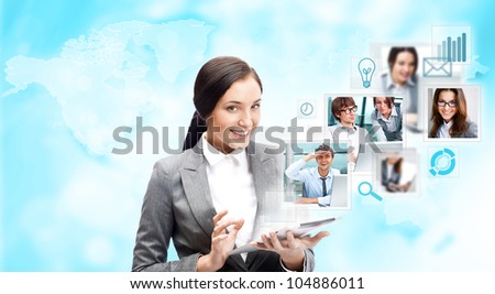 Portrait of businesswoman holding her tablet computer and communicating with her team across the world. International communications concept