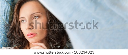 Beautiful woman standing near window. Beauty fashion portrait