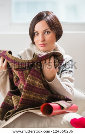 Portrait of a woman preparing to her husband or boyfriend surprise with a gift on his birthday or christmas or valentine's day or another holiday