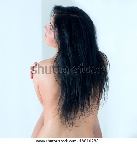Beautiful back of a young woman at bathroom at home