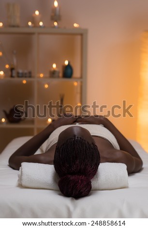 African beautiful woman getting spa at beauty salon