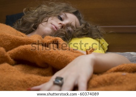 Portrait of young sexy disappointed woman in bedroom