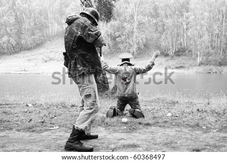 Dramatic scene of fight between soldiers black and white photo