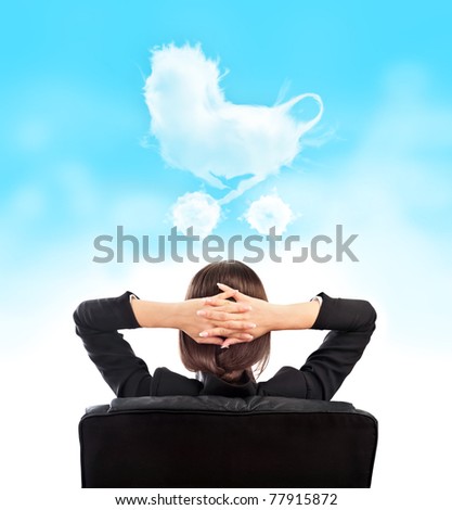 Closeup portrait of cute young relaxed business woman from behind with open hands behind her head. Dreaming about baby and family concept