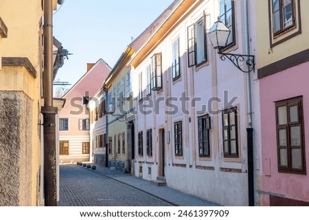 Similar – Image, Stock Photo City stroll with shuttered shop windows and a curve