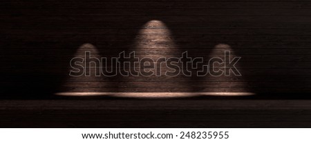 Dark wooden background with three spotlight lamps