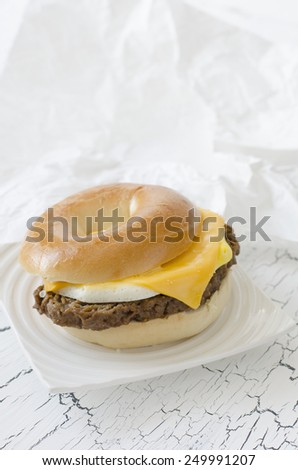 Bagel with angus beef, egg, cheese and lettuce.