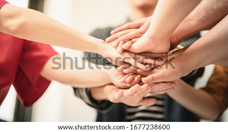 volunteer hand stack people to show teamwork spirit togetherness, Concept community of charity people volunteering with social to achievement in the future, Group of people participation of charity.