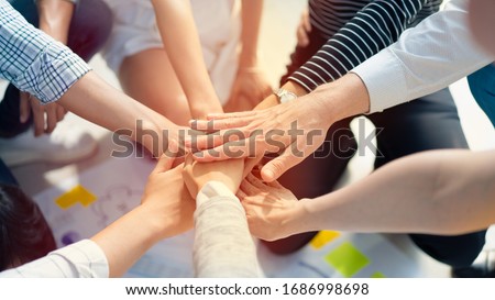 Hand join together for work togetherness, Hand stack for business and service, Team volunteering or teamwork. Concept connection of community and charity. Group of business workforce participation. 商業照片 © 