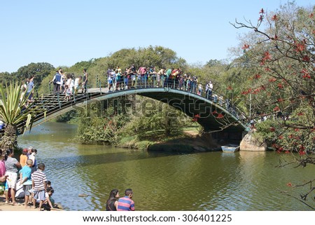 SAO PAULO, BRAZIL - August 2: Families and people in the Ibirapuera Park in late sunny week, the largest park in the city of Sao Paulo, on August 2, 2015.