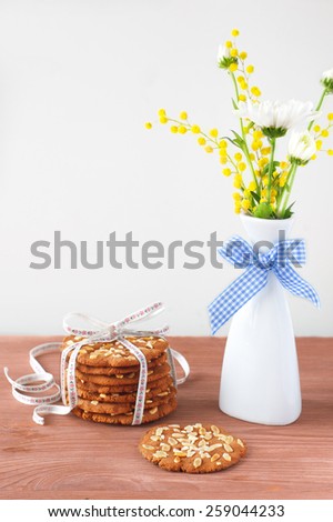 bouquet of spring flowers on the table and cookies