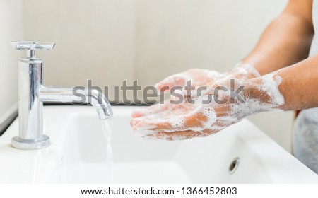 Man washing hands with soap. Stock foto © 