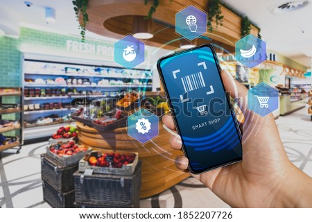 Mobile smart shop device in the checkout counter scan and go. Smart scan that allows customers to scan items from the shelves, pack them in their bag and then leave. Foto stock © 