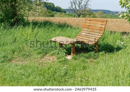 Similar – Foto Bild Liegestühle aus Holz auf Wiese