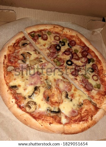 Juicy pizza, double taste: assorted and ham with mushrooms. Сток-фото © 