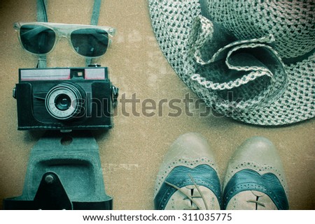 Hipster's shoes, hat, camera and sunglasses - vintage effect