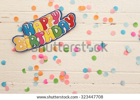 Happy birthday greeting card on confetti background