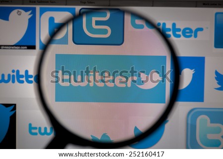 BANGKOK, FEBRUARY 13, 2015: Twitter Logo being magnified. Twitter is an online social networking service that enables users to send and read short 140-character messages called \