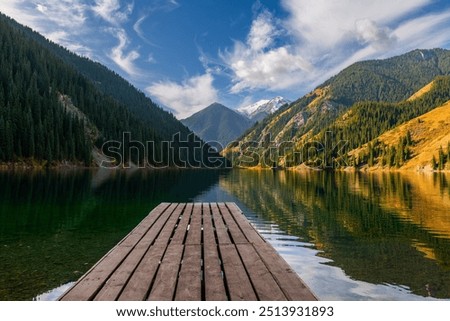 Similar – Image, Stock Photo Picturesque landscape of lake against sunset sky