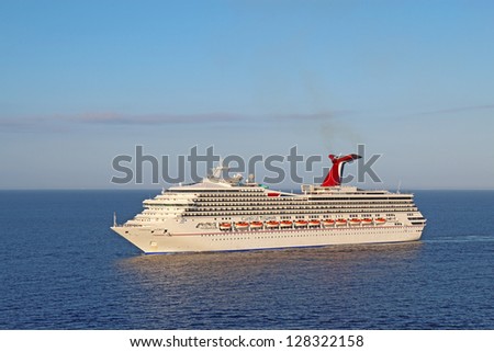 BELIZE CITY - DECEMBER 26: The cruise ship Carnival Triumph on December 26, 2011. An engine fire in February 2013 caused the ship to lose power and it was towed into port after being adrift for days.