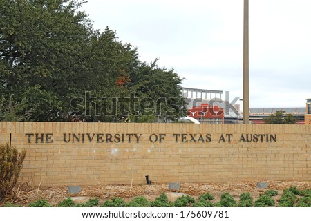 AUSTIN, TEXAS - FEBRUARY 2 2014: Sign for the University of Texas at Austin with Darrell K Royal-Ã?Â�Texas Memorial Stadium in the background. Founded in 1883, it is one of the top 20 schools in the USA.