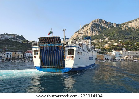 CAPRI, ITALY - OCTOBER 10 2014: Caremar ferry Naiade arriving at Marina Grande on the isle of Capri. Ferries provide transport of passengers and vehicles to many destinations in the Gulf of Naples.