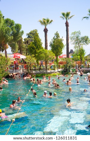 PAMUKKALE, TURKEY - MAY, 4: Tourists swim in Cleopatra\'s pools on May 4, 2012 in Pamukkale, Turkey. Cleopatra\'s pools made for queen Cleopatra nowadays become one of the most visited sight in Turkey.