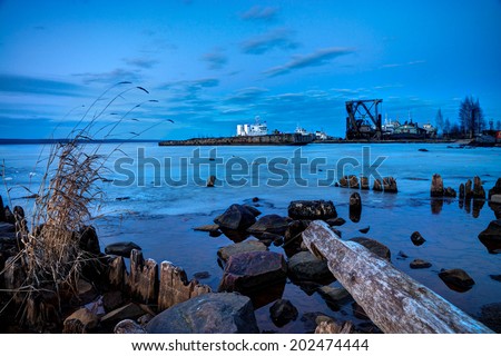 Evening view at Onega lake port with construction site, Karelia, Russia