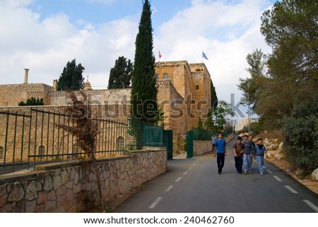 JERUSALEM, ISRAEL - NOVEMBER 03, 2011: Several teenagers walking on street in Cross Valley in Jerusalem, Israel. On the valleys west side is the hill of Givat Ram and the Israel Museum