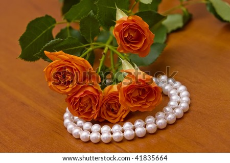 Elegant pearl neclace and beautiful roses