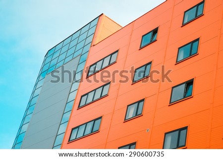 Orange house on blue sky background.