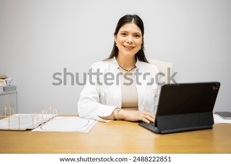 Similar – Image, Stock Photo Fitness woman consulting her training on her smartphone sitting in a jump box in the gym