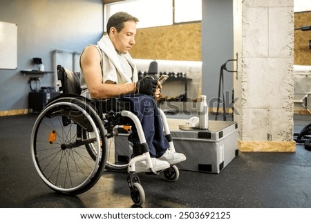 Similar – Image, Stock Photo Disabled athlete using phone