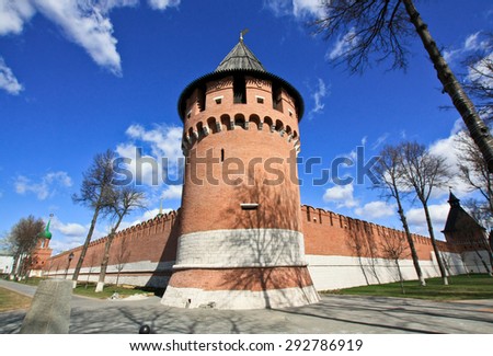 Red tower of a Russian Kremlin on a sunny day