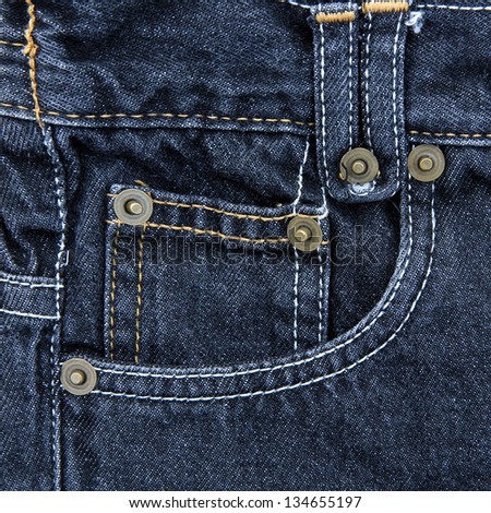 Jeans pocket. Fragment of blue jeans.