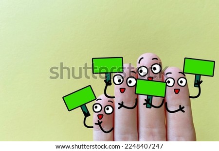 Four fingers are decorated as four person. All of them are holding a green board showing a positive feedback.