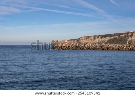 Similar – Image, Stock Photo An imposing landscape of rugged mountains and fields that extend to the horizon