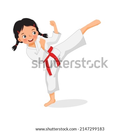 cute little karate kid girl with red belt showing kicking attack techniques poses in martial art training practice