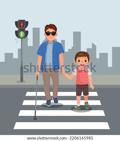 Cute little boy helping blind man crossing street at the pedestrian traffic