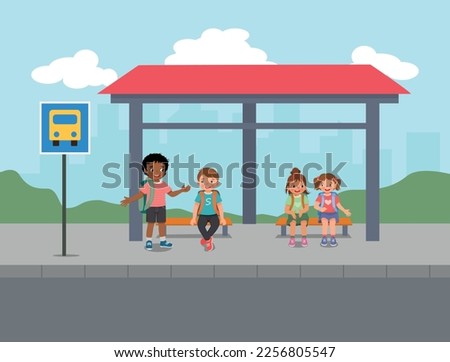 Group of little students talking while waiting for school bus at the bus stop