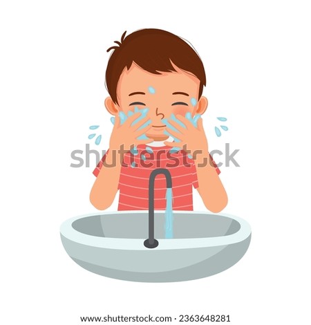 Cute little boy washing face in the sink